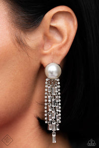 Gradually decreasing in length, strand after strand of glittery white rhinestones and emerald-cut white gems stream from silver fittings, creating a refined fringe that falls effortlessly from a solitaire oversized pearl for an elegant centerpiece. Earring attaches to a standard post fitting.  Sold as one pair of post earrings.