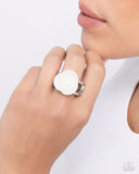 Featured in the center of an airy silver band, a white rosette is formed from shiny shell petals for a blooming basic atop the finger. Features a stretchy band for a flexible fit.  Sold as one individual ring.