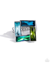 Set in a topsy-turvy silver frame, a collection of blue multicolored emerald-cut gems form into an airy square for a sinuous shimmery centerpiece. Features a stretchy band for a flexible fit.  Sold as one individual ring.