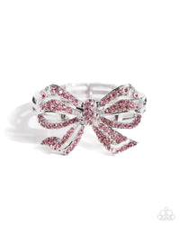 Infused along elastic stretchy bands, airy silver frames gleam along the wrist for a monochromatic display. Encrusted in light rose rhinestones, an oversized, airy silver bow glitters at the center of the design for a touch of class and refinement.  Sold as one individual bracelet.