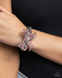 Infused along elastic stretchy bands, airy silver frames gleam along the wrist for a monochromatic display. Encrusted in light rose rhinestones, an oversized, airy silver bow glitters at the center of the design for a touch of class and refinement.  Sold as one individual bracelet.