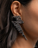 Featuring black rhinestones, a pair of airy silver lightning bolts flicker and flash along the ear for a dazzling design. Earring attaches to a standard post fitting.  Sold as one pair of post earrings.