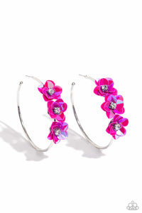 A trio of Fuchsia Fedora flowers, featuring an iridescent sheen and dotted with white pronged rhinestone centers, blossoms atop a thin silver hoop for a dreamy, whimsical finish. Earring attaches to a standard post fitting. Hoop measures approximately 2 1/2" in diameter. Due to its prismatic palette, color may vary.  Sold as one pair of hoop earrings.