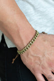 Shiny brown cording knots around the ends of a brass beveled cable chain that is wrapped across the top of the wrist for a versatile look. Features an adjustable sliding knot closure.