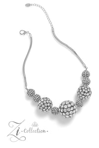 Glittery, white rhinestones cluster together, creating dramatically oversized, airy, spheres that sparkle vivaciously. Smaller rhinestone-encrusted spheres dance between the exaggerated accents, resulting in a dynamic display of texture and sheen. Features an adjustable clasp closure.