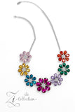 Colorful teardrop-shaped petals fan out around clusters of corrugated sparkle, blossoming into an enchanted kaleidoscope. The faceted surfaces of each petal add texture and depth, allowing the floral frames to pop with 3D detail and further highlight the spectrum of color at play. Features an adjustable clasp closure.