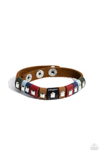 Sections of green, blue, red, brown, and black leather wrap around an urban brown leather band. Emerald-cut silver frames stud the centers of each multicolored suede band, adding a touch of industrial grit to the rustic display. Features an adjustable snap closure.  Sold as one individual bracelet.