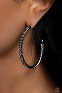 Shimmering gunmetal spins into an oversized twisted rope as it curves into a classic thick hoop design. Earring attaches to a standard post fitting. Hoop measures approximately 2" in diameter.  Sold as one pair of hoop earri