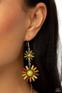 Dotted with a Peach Pink center, emerald-cut olive and Leek Green bars encircle a dainty sunburst frame. Dotted with a larger Leek Green center, emerald-cut olive, Leek Green, Burnt Sienna, and Peach Pink bars delicately fan around a larger sunburst frame, creating an overlapping sunny lure. Earring attaches to a standard fishhook fitting.  Sold as one pair of earrings.