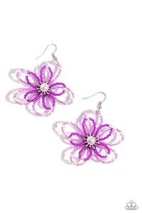 A glossy white pearl blooms from the center of a layered Rose Violet and plum glassy seed bead flower, infused with additional dainty white pearls, creating a colorful floral frame. Earring attaches to a standard fishhook fitting.  Sold as one pair of earring