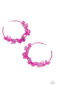 Fluttering along an oversized, electric pink hoop, various-sized butterflies, some featuring iridescent rhinestones, dance along the ear for a whimsical centerpiece. Earring attaches to a standard post fitting. Hoop measures approximately 3" in diameter. Due to its prismatic palette, color may vary.  Sold as one pair of hoop earrings.