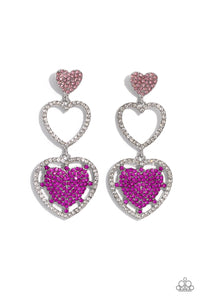 A light rose-encrusted silver heart, white rhinestone-encrusted silver heart frame, and fuchsia rhinestone-encrusted layered heart frame gradually increase in size as they delicately interconnect and stack into a dazzling lure for an elegant effervescence. Earring attaches to a standard post fitting.  Sold as one pair of post earrings.