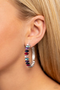 Dazzling multicolored marquise-cut gems fall in line along the front edge of a classic silver hoop. The exposed edges create a gritty silhouette, beautifully contrasting with the blinding shimmer of the gems in a stunning finish. Earring attaches to a standard post fitting. Hoop measures approximately 1 1/2" in diameter.  Sold as one pair of hoop earrings.