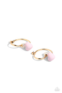 A solitaire white pearl attaches to a double-sided gold post, designed to fasten behind the ear. Dotted with a light pink acrylic heart, the double-sided post peeks out beneath the ear for a romantic look. Hoop measures approximately 1" in diameter.  Sold as one pair of double-sided hoop earrings.