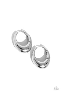 <p>Featuring a thick surface, an elongated silver hoop curls around the ear for a sleek basic look. Earring attaches to a standard hinge closure fitting. Hoop measures approximately 3/4" in diameter.</p> <p><i> Sold as one pair of hinge hoop earrings.</i></p>