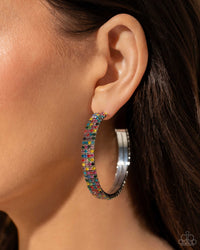 <p>Set in silver square fittings, row after row of multicolored rhinestones are embellished around a silver hoop for a dazzling design. Earring attaches to a standard post fitting. Hoop measures approximately 2" in diameter.</p> <p><i> Sold as one pair of hoop earrings.</i></p>