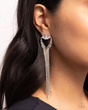 <p>Pressed in silver-pronged fittings, a trio of white emerald-cut gems delicately perch at the base of an upside-down silver teardrop frame. Dainty silver chains taper along the edges of the teardrop frame for a glitzy, refined lure. Earring attaches to a standard post fitting.</p> <p><i> Sold as one pair of post earrings.</i></p>